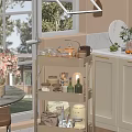 Bright Kitchen Interior With White Cabinets Three Tier Cart And Marble Countertop