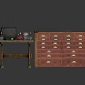 Vintage Wooden Table With Metal Pot And Bottles Alongside Red Multi Drawer Cabinet