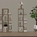 Modern Wooden Bookcase With Tiered Shelves Books Decorative Items Table Lamp And Potted Plant
