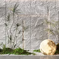 Garden Ornament Featuring Gray Stone Wall White Pebbles Tall Plants Ferns And Glowing Moon Ball