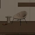 White Fabric Lounge Chair With Black Metal Legs And Round Side Table On Beige Carpet