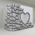Silver Event Entrance With Petal Shaped Protrusions Heart Shaped Mirror Wooden Frame And Brown Cabinets