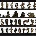 Hand Carved Wooden Sculptures On Shelves With Various Artistic Shapes And Designs