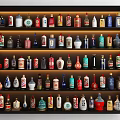 Various Colored Shaped Wine Bottles Neatly Arranged On Multiple Shelf Display Rack