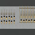 Gold And Black Metal Springs With Connectors On Wall Mounted Rack