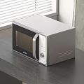Modern Kitchen Microwave Oven Placed On Dark Wooden Table With Window Blinds And Wall Art