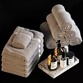 Bathroom Accessories With Rolled And Stacked Towels Liquid Soap Bottles On Marble Tray