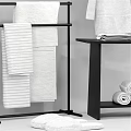 Organized Bathroom Essentials With Storage Shelves Towels Robe Bottles And Toiletries