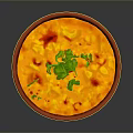 Delicious Yellow Creamy Dish in Red Patterned Bowl with Fresh Green Cilantro and Red Garnish