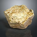 Beige Stone With Golden Specks Placed On Wooden Surface For Natural Decor