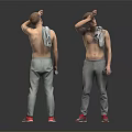 Shirtless Man Wearing Gray Sweatpants and Red Sneakers with Towel on Shoulder Holding Water Bottle