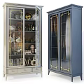 White And Navy Blue Display Cabinet With Glass Doors Gold Accents And Decorative Items