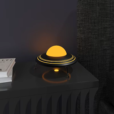 Modern UFO Style Lamp with Yellow Spherical Light Black Base on Table with Books 3d model