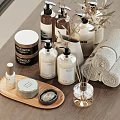 Bath Essentials Collection Featuring Skincare Bottles Soap Towels Diffuser Sticks And Wooden Tray