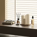Elegant Decorative Accessories Set With Candles Aromatherapy Bottle Eyeglasses On Wooden Table By Window Blinds
