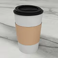 White Paper Cup With Black Lid And Brown Paper Sleeve On Marble Tabletop