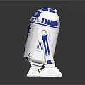 R2 D2 Robot Character With Blue White Design Silver Accents And Shiny Surface