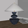Modern Black Base Table Lamp With White Lampshade And Magazines On Wooden Table