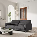 Modern Gray Textured Sofa and Round Coffee Table Set with Green Plant and Wooden Door