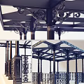 Ornate Metal Pavilion Structure With Carved Columns And Decorative Roof Design