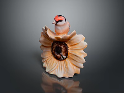 A red headed bird perched on yellow sunflower shaped decorative ornament 3d model
