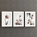 Three Framed Botanical Paintings with Pink Flowers and Green Leaves on Gray Wall