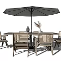 Outdoor Patio Table And Chair Set With Woven Design Umbrella Decorative Vase And Dried Flowers