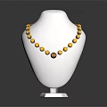 Yellow Beaded Necklace With Red Accent Beads And Pendant On Mannequin