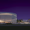 Modern Cultural Center Building With Illuminated Glass Facade And Outdoor Plaza At Night