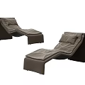 Two Modern Brown Leather Lounge Chairs With Ergonomic Backrest And Cushioned Seats