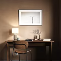 Wooden Desk Setup With Table Lamp Books Chair And Framed Artwork By Window With Blinds