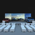 Modern Auto Show Booth Featuring Large Screen Display Cars Seats And Attendees