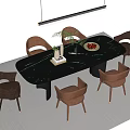 Elegant Black Marble Dining Table Set With Brown Chairs Green Plant Candles And Fruit Platter