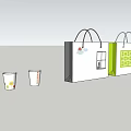 Various Designed Cups With Colorful Patterns Alongside Shopping Bags