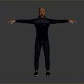 Man Standing With Arms Outstretched In Dark Long Sleeve Top And Pants