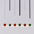 Hanging Downlights And Spotlights With Neatly Arranged Red Green Apples Below
