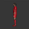 Liverpool Football Player Wearing Red Jersey With Team Logo And Shorts