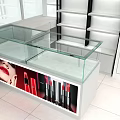 Beauty Product Store With Glass Display Cases Lipsticks And White Shelves
