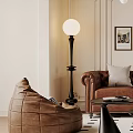 Comfortable Brown Bean Bag Chair With Plaid Cushion Wooden Chest Vase Flowers And Framed Artwork