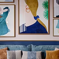 Blue Two Seater Sofa With Colorful Throw Pillows And Blanket Against Decorative Wall Art