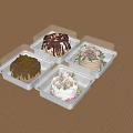 Four Cakes With Various Decorations In White Plastic Containers And Transparent Lids On Wooden Tabletop