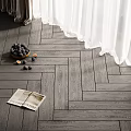 Dark Gray Herringbone Wood Flooring With White Curtains Bowl Of Fruits And Magazine