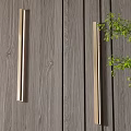Modern Wall Sconces Mounted on Wooden Texture Wall with Green Foliage Accent