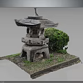 Traditional Stone Lantern With Carved Details And Green Bush On Grass Base