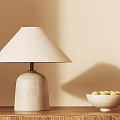 Modern Table Lamp With Concrete Base Linen Shade On Wooden Table With Fruit Bowl