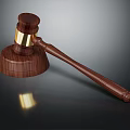 Wooden Gavel With Golden Accents On Carved Handle And Dark Background