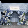 Elegant Photo Spot With Light Blue Arch Curtains And Blue White Floral Decorations