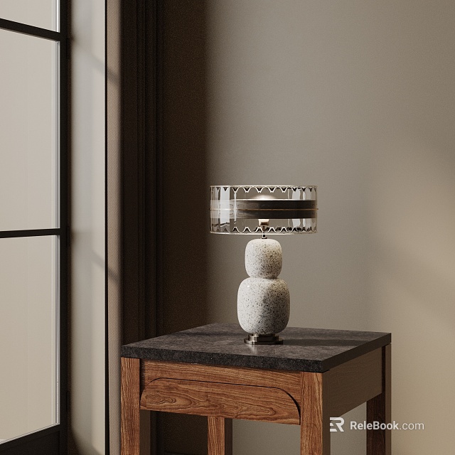 Transparent Lampshade Table Lamp With Stacked Stone Base On Dark Wooden Cabinet Top 3d model 