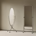 Oval And Rectangular Mirrors With Metal Frames And Wheels In Light Colored Room With Blinds
