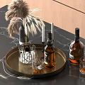Wine Bottles and Glasses on Brass Tray with Ice Cubes Pampas Grass Dark Marble Countertop
